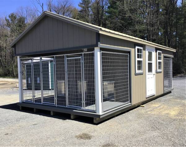 Stock Model 2023S, a 12x24 Dog Kennel with clay siding, dark gray trim, desert metal roof, prehung door, four 24x36 insulated windows, and a finished interior with an electrical package.